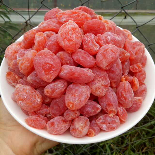 Dried olives are sweet and sour, a favorite snack of many people